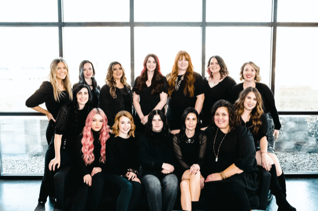 Group photo of the West Ivie Collective team in black attire, showcasing local business professionals at Utah County.